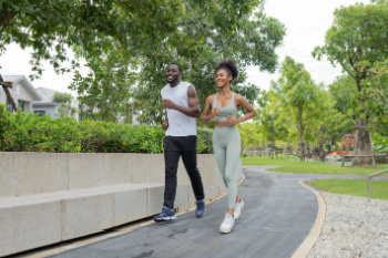 Exercise and the feet african american male and female adults running ssR